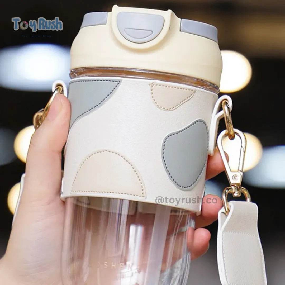 Classy Sipper Bottle with Faux Leather Sleeves, Straw and Strap - Toy Rush