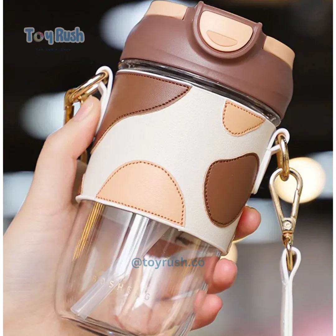 Classy Sipper Bottle with Faux Leather Sleeves, Straw and Strap - Toy Rush